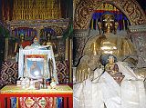 307 Jharkot Gompa Statues Of Buddha The altar at the Jharkot Gompa has two statues of Buddha. The photo in front of the altar is the 41st Sakya Trizin, the head of the Sakya Buddhist sect.